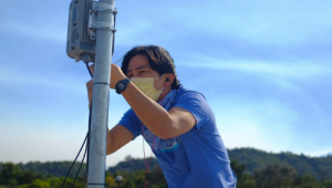 man installing a wifi access point