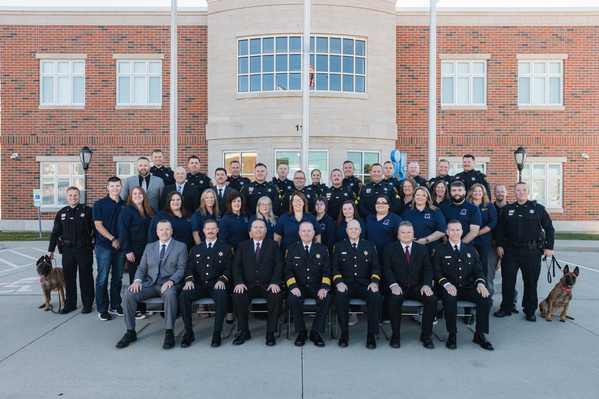 Employees of the police department in front of the police station