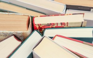 A group of books viewed from above.