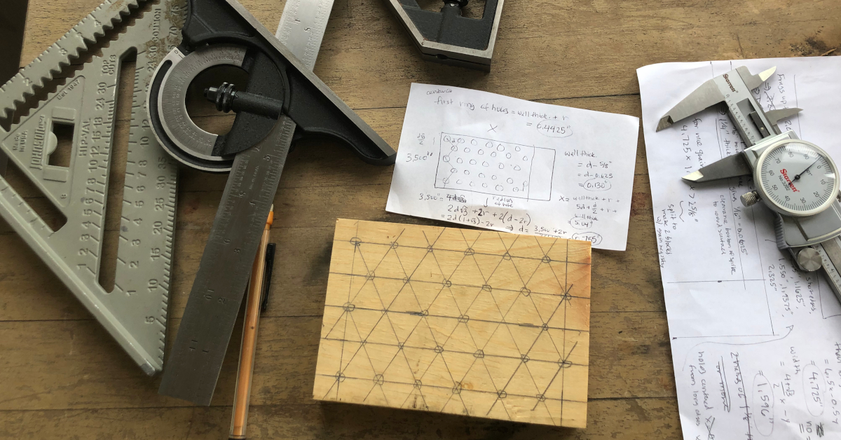 Measuring tools and notes on paper together on a desk or table top.