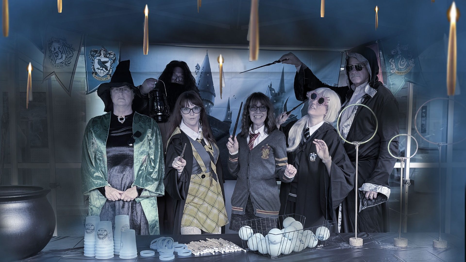 A group of people dressed up for Halloween as characters from the Harry Potter franchise.