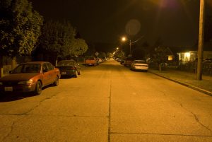 Shows streetlights in a neighborhood