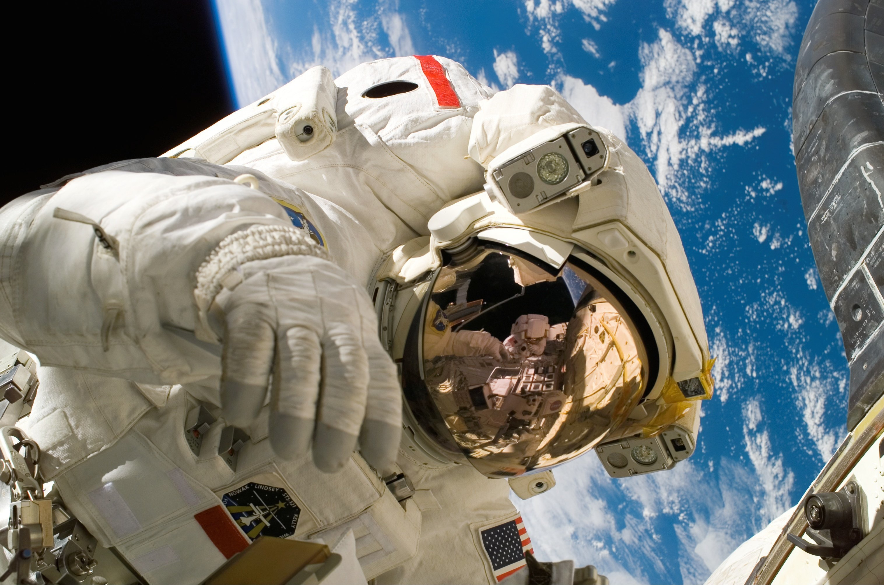 Astronaut in space with Earth behind