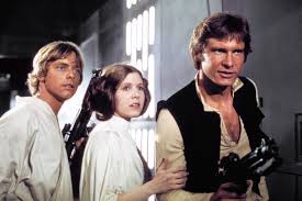 Luke Skywalker, Leia Skywalker and Han Solo stand together in support of saving the galaxy.