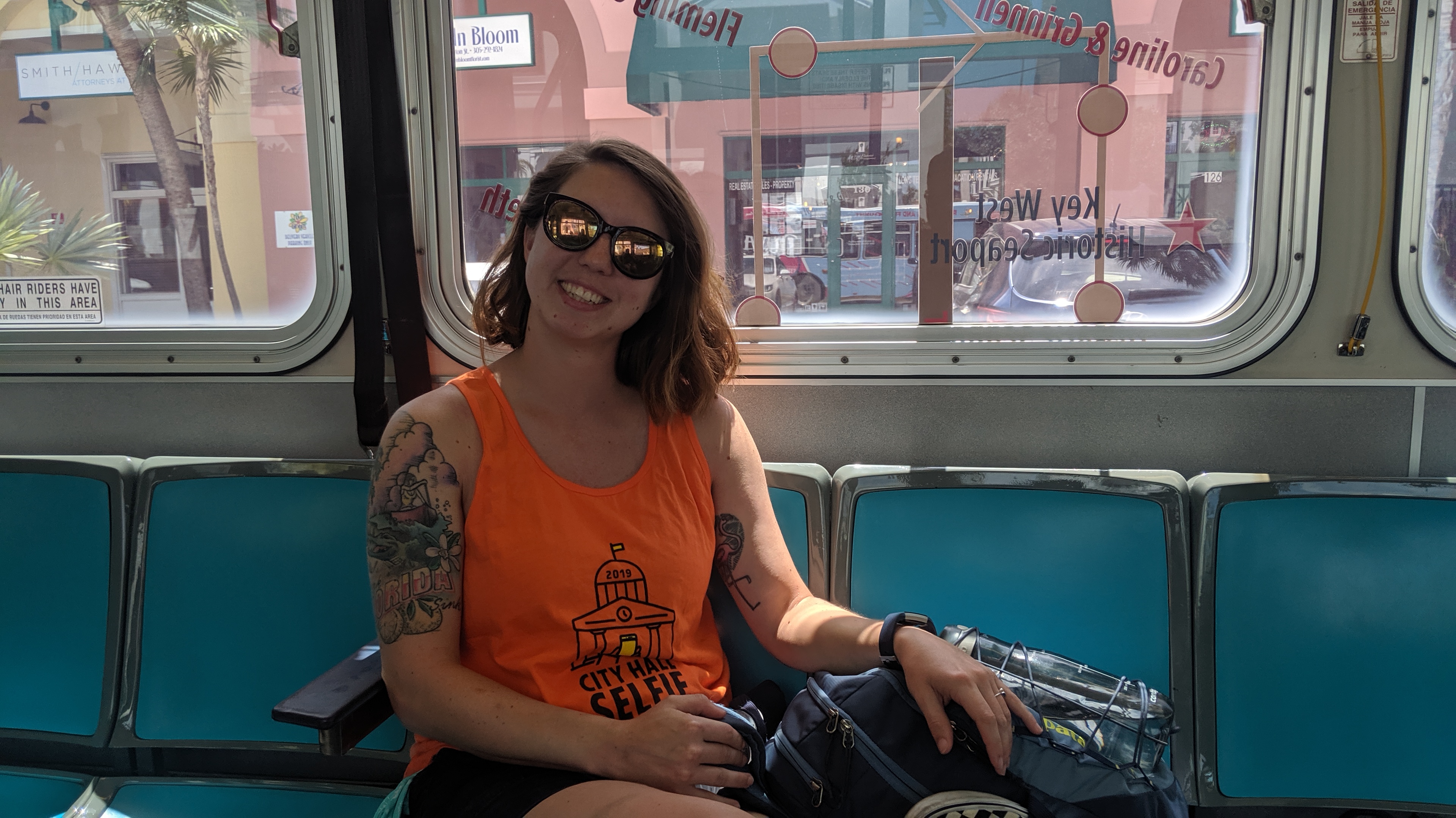 woman smiling on a city bus