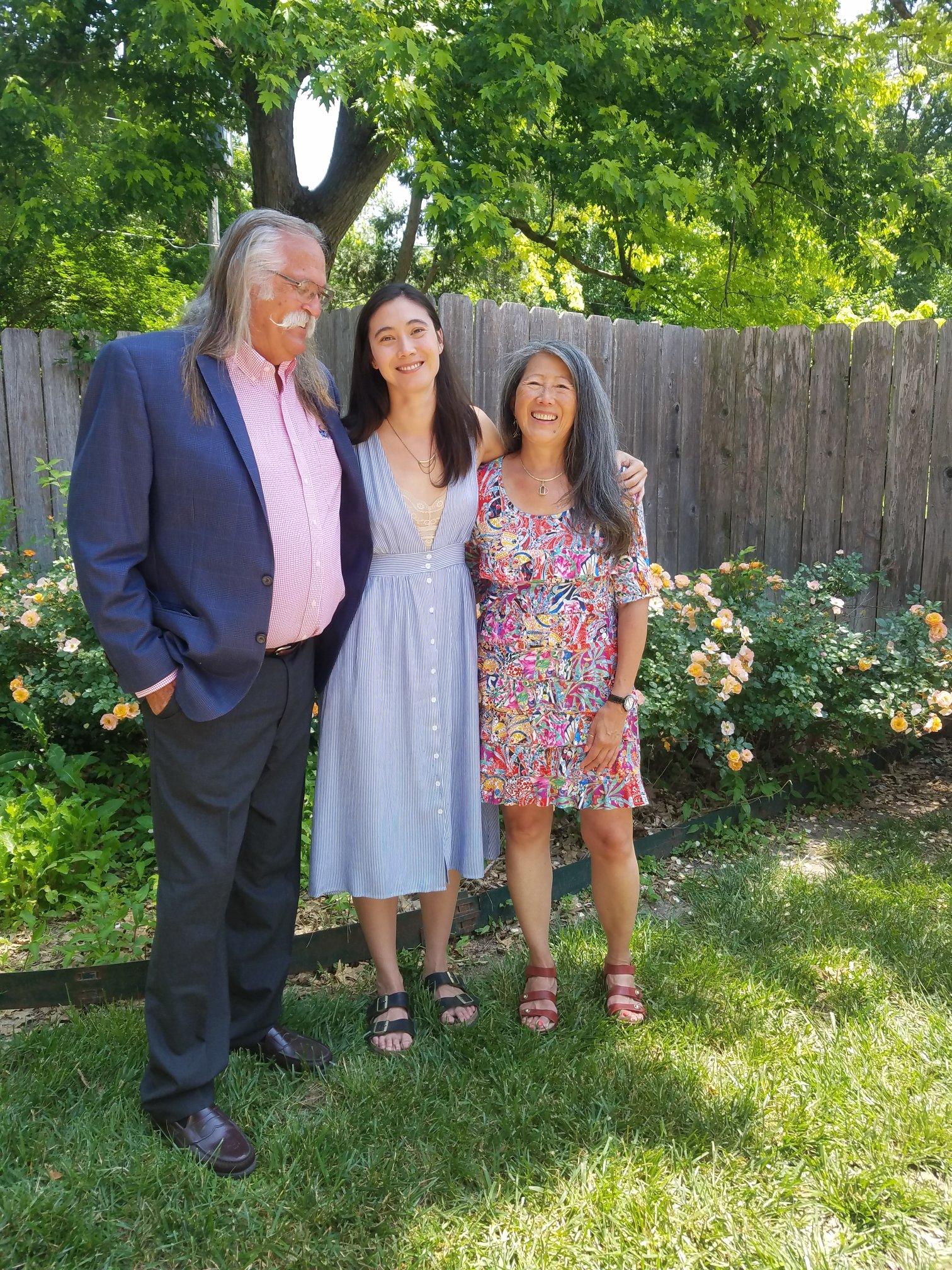 Author poses with her mom and dad