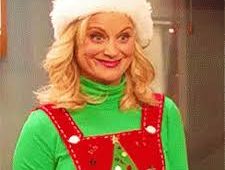 Image Lesley Knope in Santa hat and romper with Christmas tree