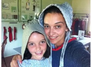 A girl and her mom in bonnets