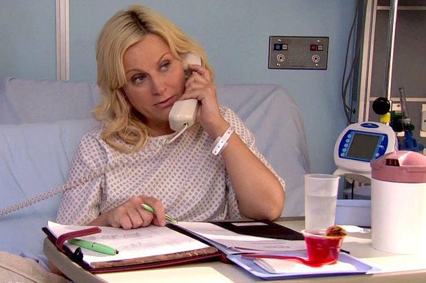 leslie knope in hospital bed working