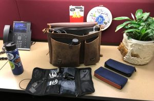 A leather bag with various organizers