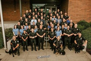 Staff photo of McMinnville police department. Large group of police officers standing on steps.