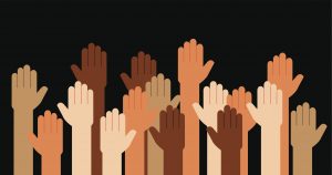 Multi-racial hands raised