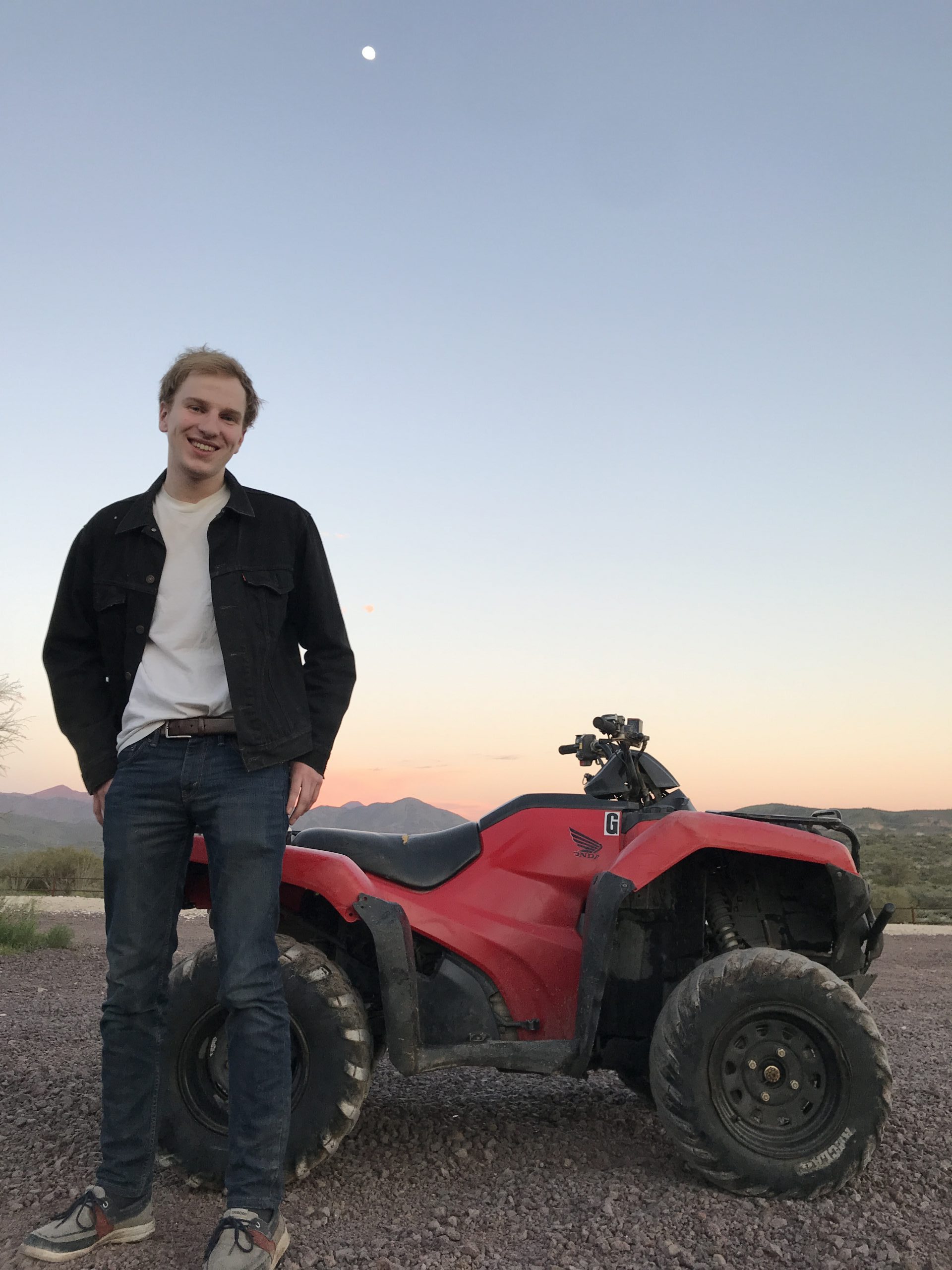 Georges next to four wheeler