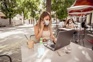 woman conducting business online, outdoors