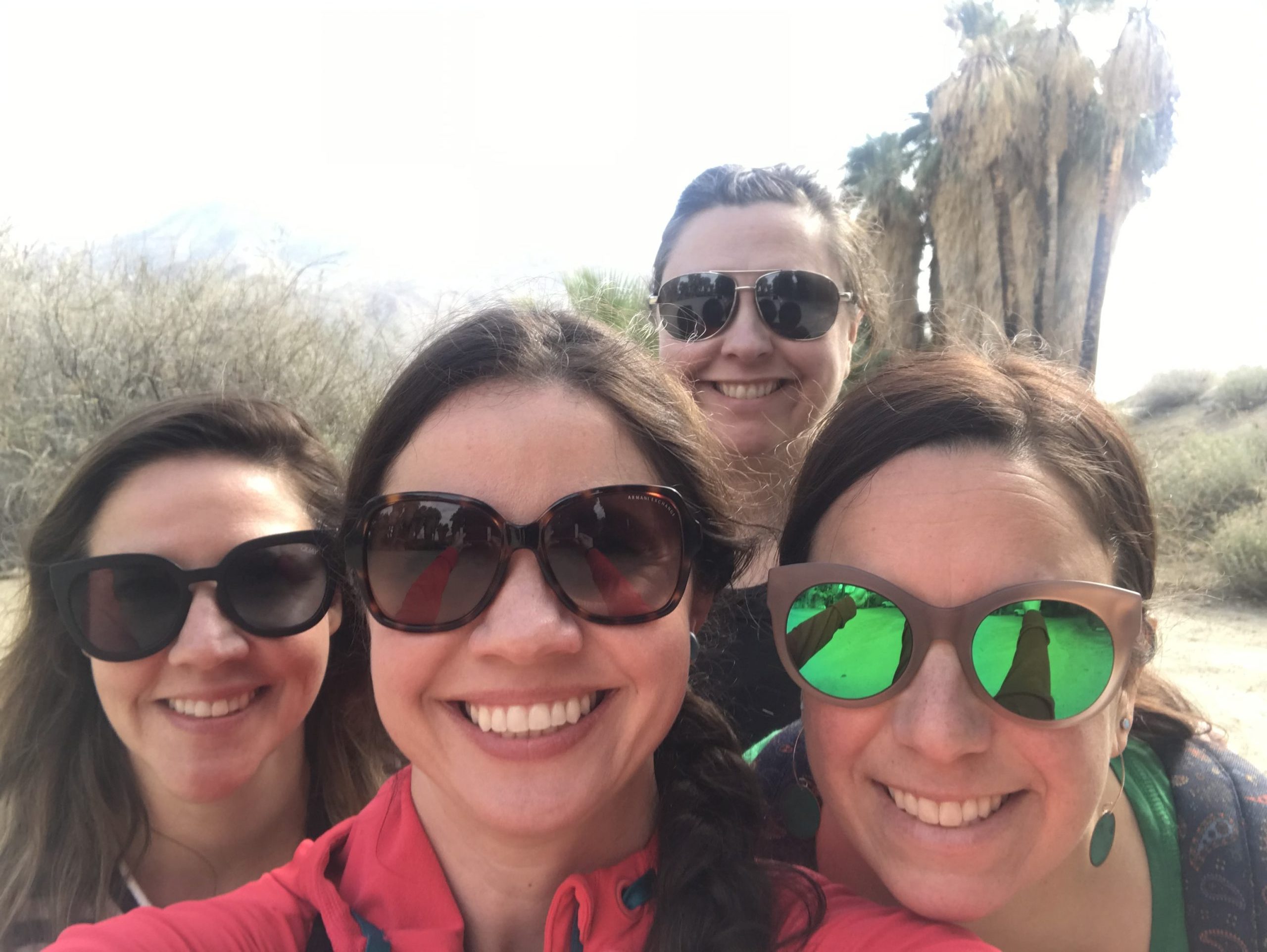 Jesssica smiling with her family outdoors