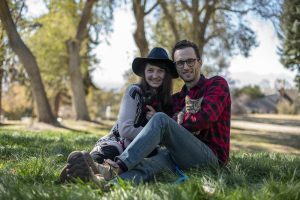 Christianna with partner and dogs smiling at camera