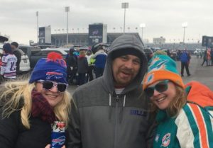 Amie Hendrix and friends posing in front of the Bills Stadium.