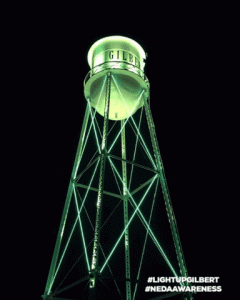 Water tower in Gilbert, AZ lit in blue and green for National Eating Disorder Week