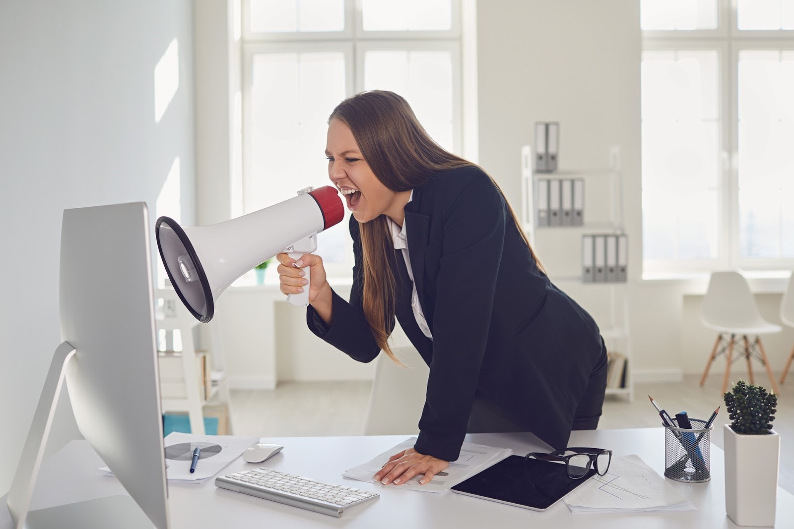 Woman yelling at computer