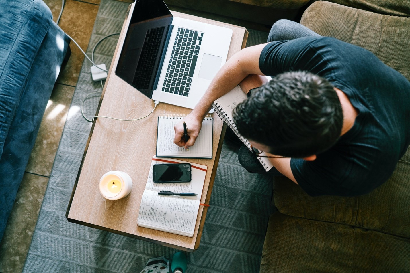 Person working at coffee table