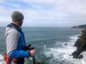 Kevin looking down the cliffs on the Oregon Coast