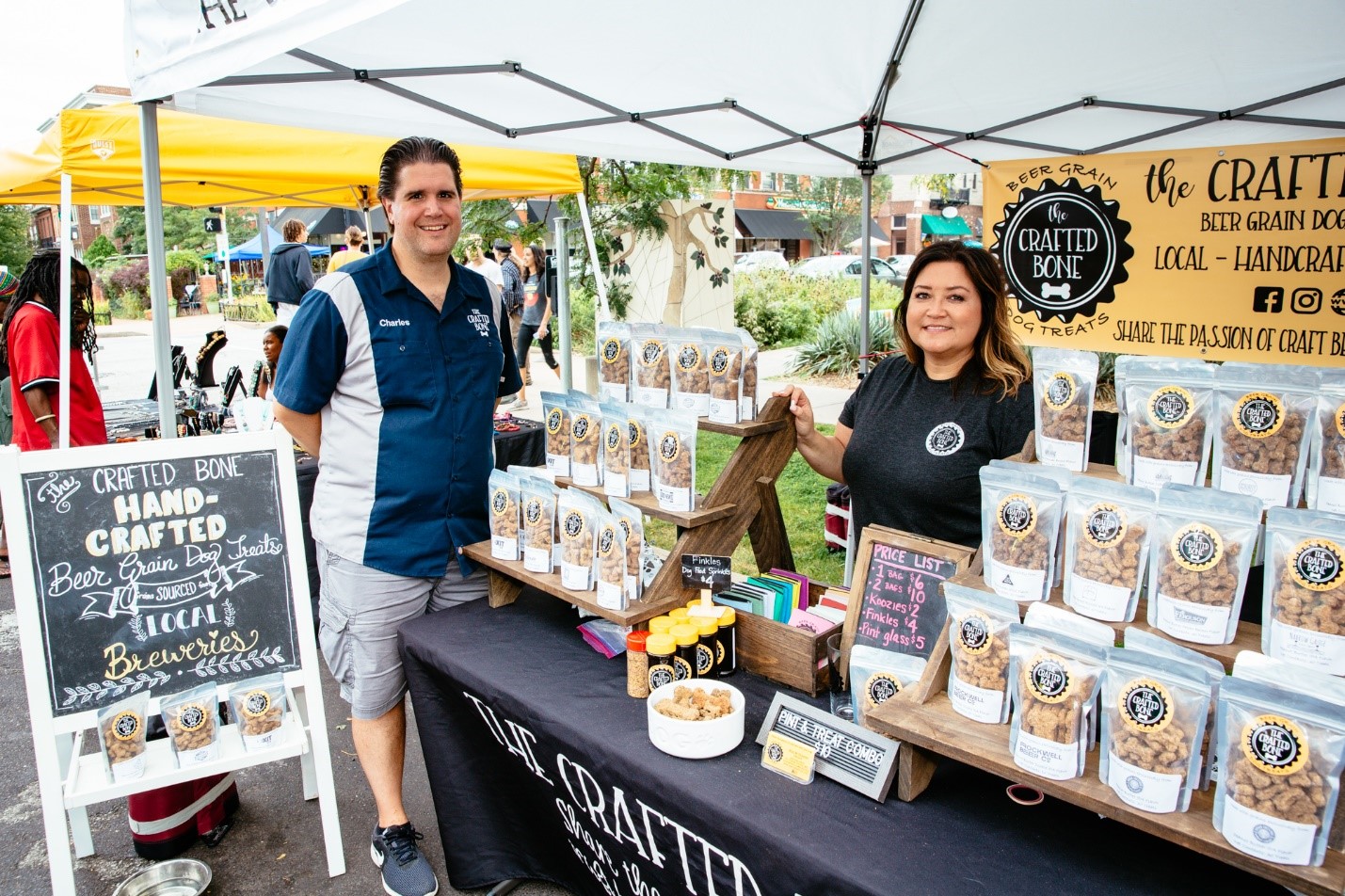 Two people selling honey at Farmers' Market