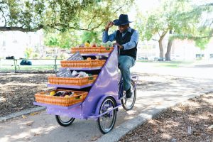 man riding business tricycle