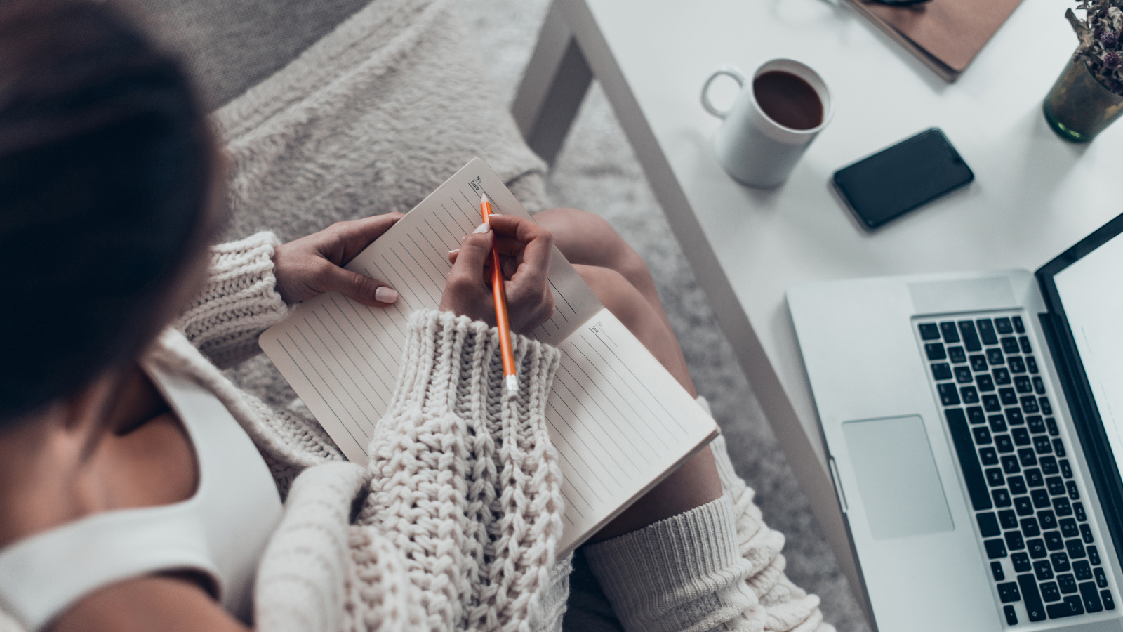 Women writing at desk