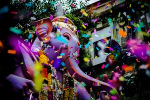 A parade with a bunch of colorful confetti