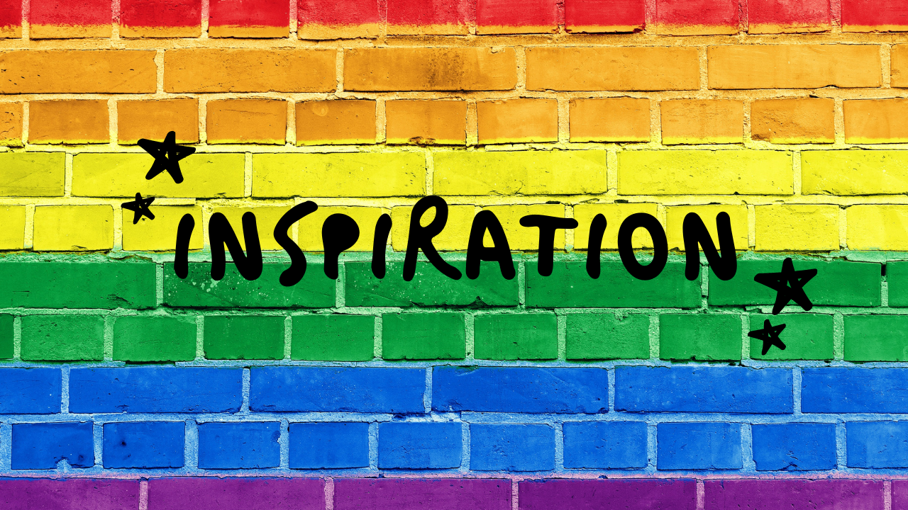 Black inspiration text with black stars on either side of the word. Background is brick wall in rainbow colors