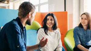 Three people talking in an engaging manner