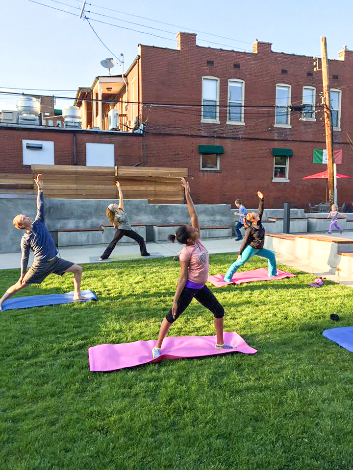 People doing Yoga on a sunny day in Ritz Park