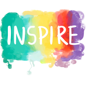 The word inspire embedded in a spray painted rainbow