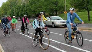 People biking and smiling