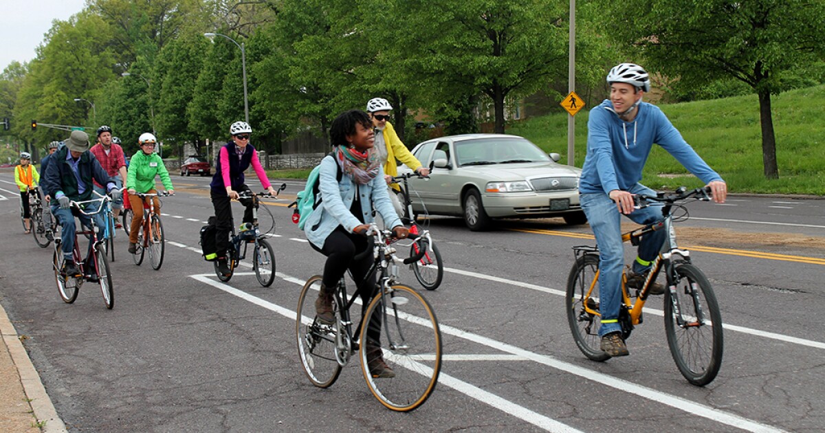 People biking and smiling