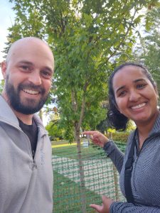 Kevin and Roopa with a street tree