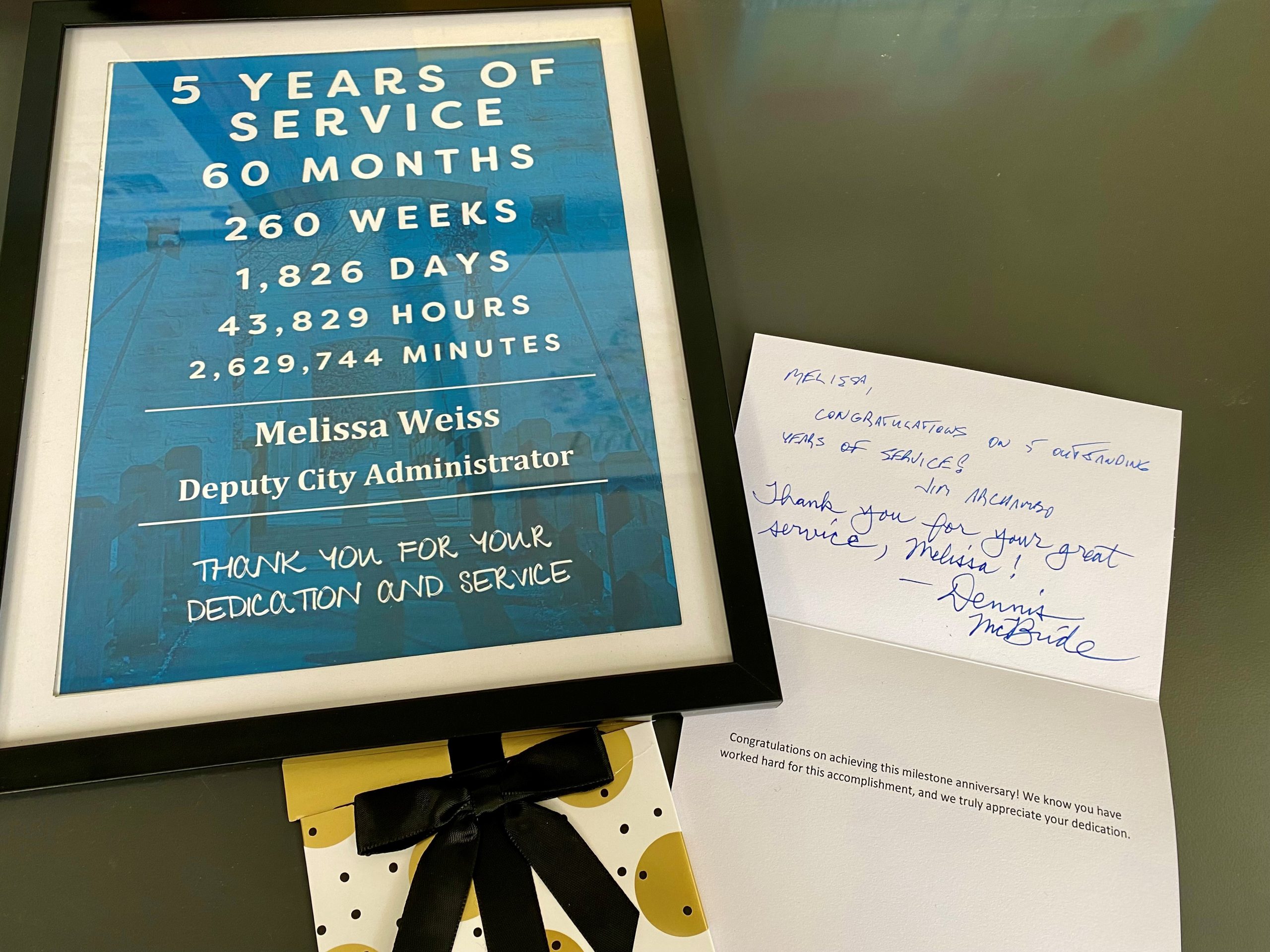 picture of employee recognition certificate, handwritten thank you note, and a gift card