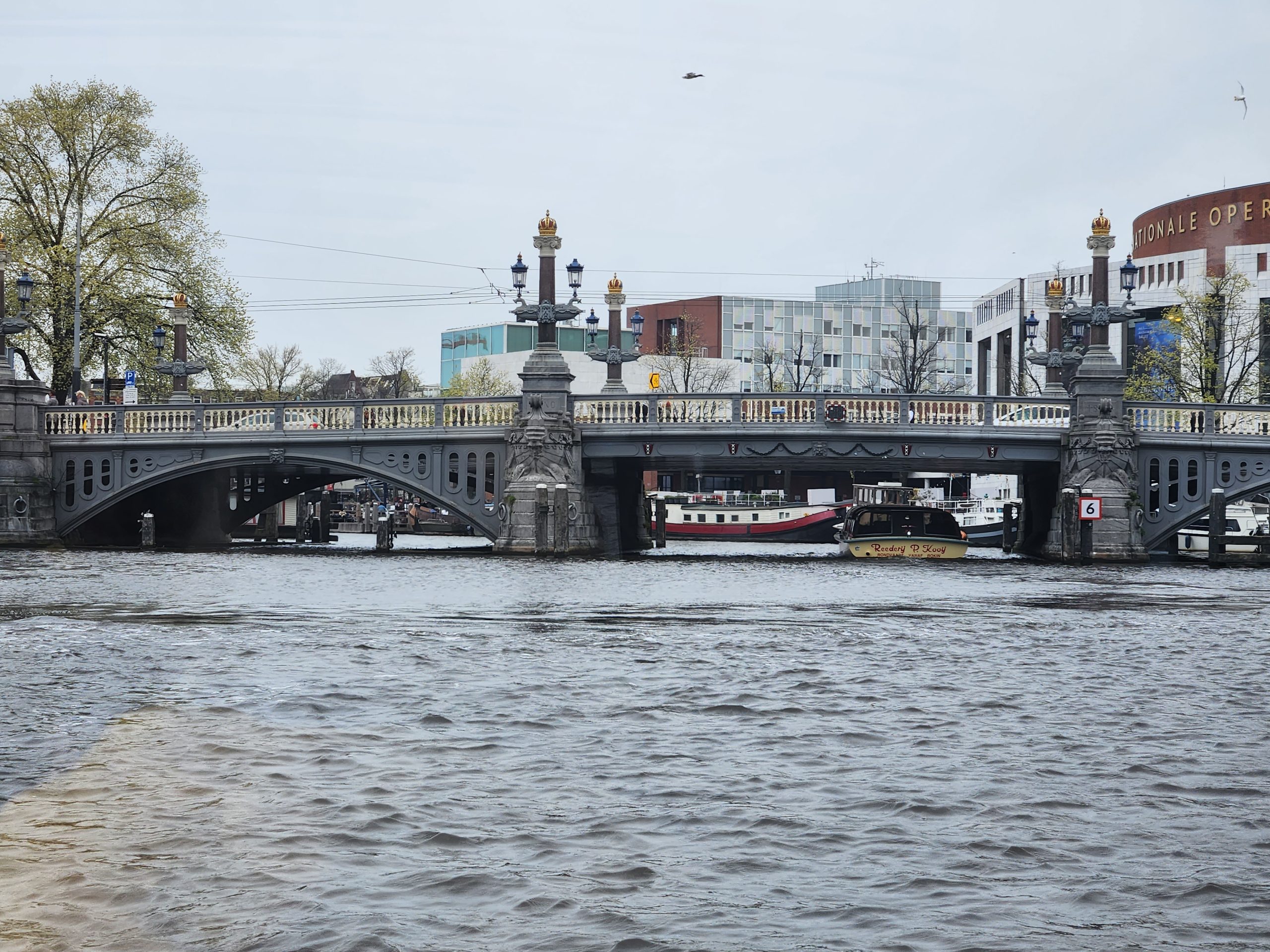 Ornate light poles on a bridge in Amsterdam.