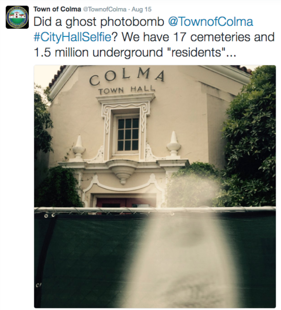 A tweet showing a blurry apparition in a City Hall Selfie from the City of Colma, CA.