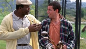Carl Weathers and Adam Sandler on a golf course, in a scene from Happy Gilmore.