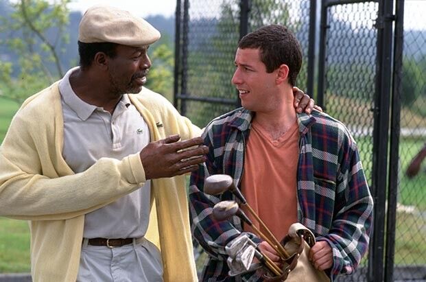 Carl Weathers and Adam Sandler on a golf course, in a scene from Happy Gilmore.