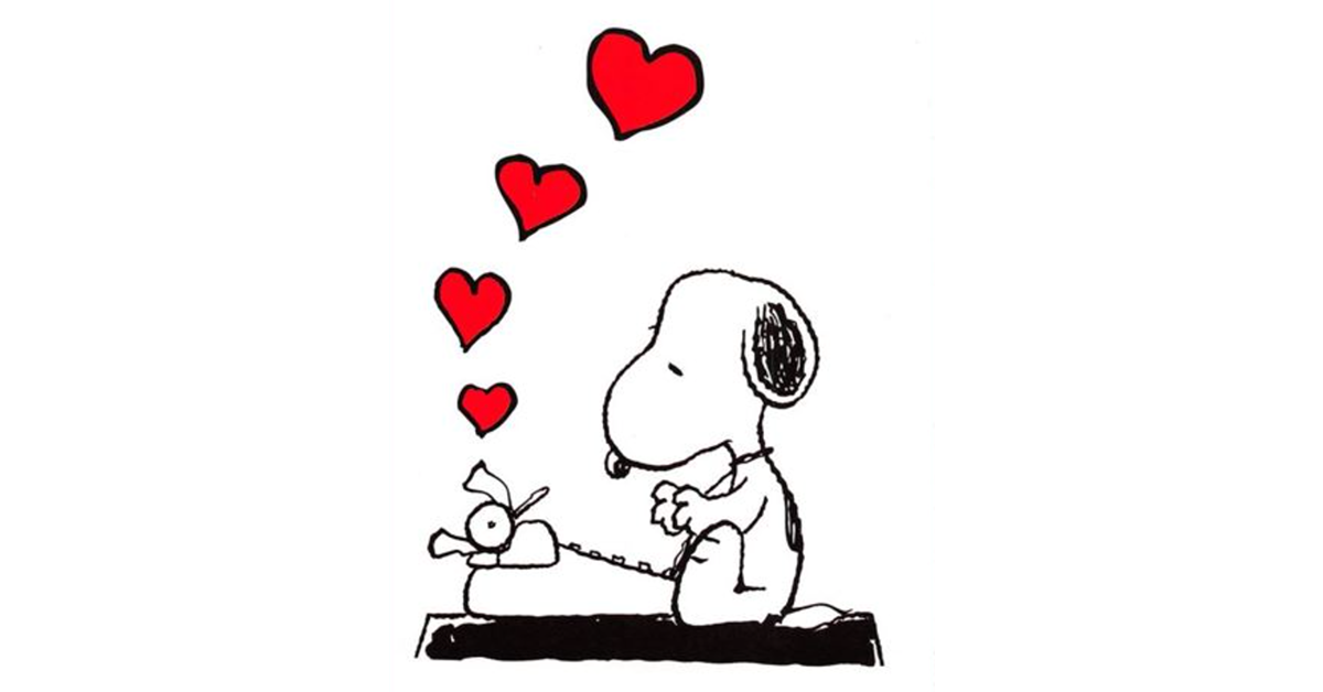 Snoopy sits at a typewriter. Four red hearts float above the typewriter.