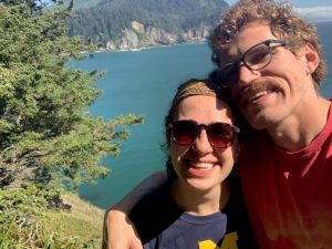 Michelle Rubin in front of Crater Lake with Partner