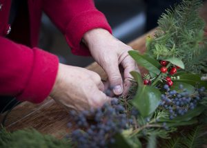 hands making a wreath