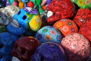 A photo of many colorful painted skulls,
