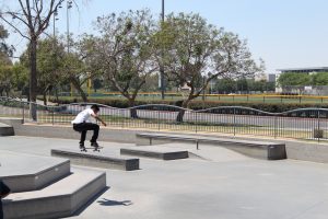 A shot of a boy riding his skateboard at Centennial Skatepark in Santa Ana.