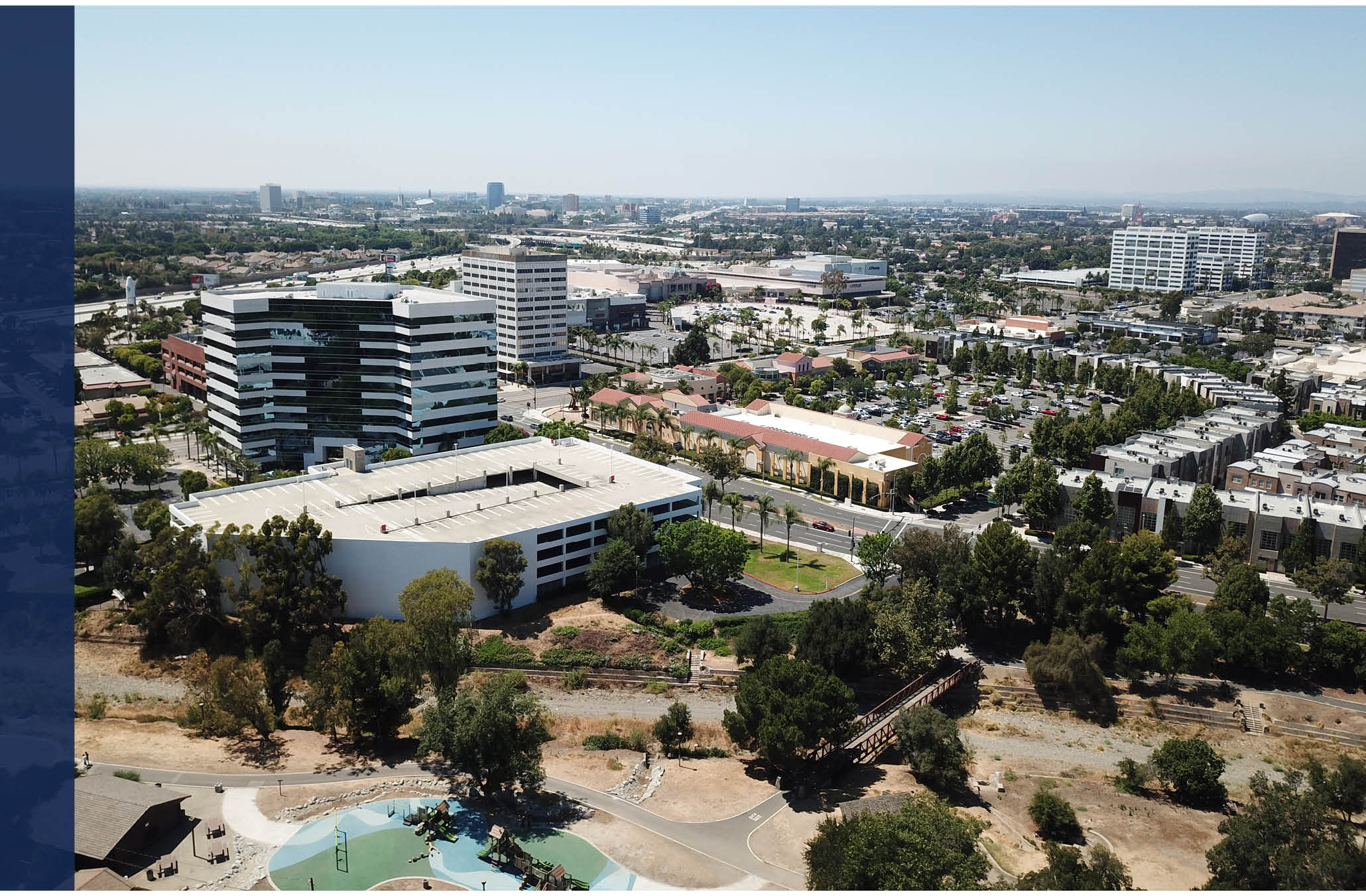 Land Use Element Cover Photo: Aerial view of Northern Santa Ana with Santiago Park and Santiago Creek Bike Trail in the foreground next to office development and two mixed-use areas (one current and one future)