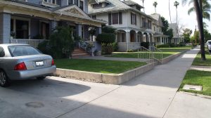 A blue house in a residential neighorhood in the daytime