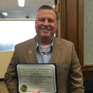 Holyoke Fire Captain Kevin McDonnell with award