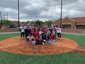 Boys baseball team on home plate.